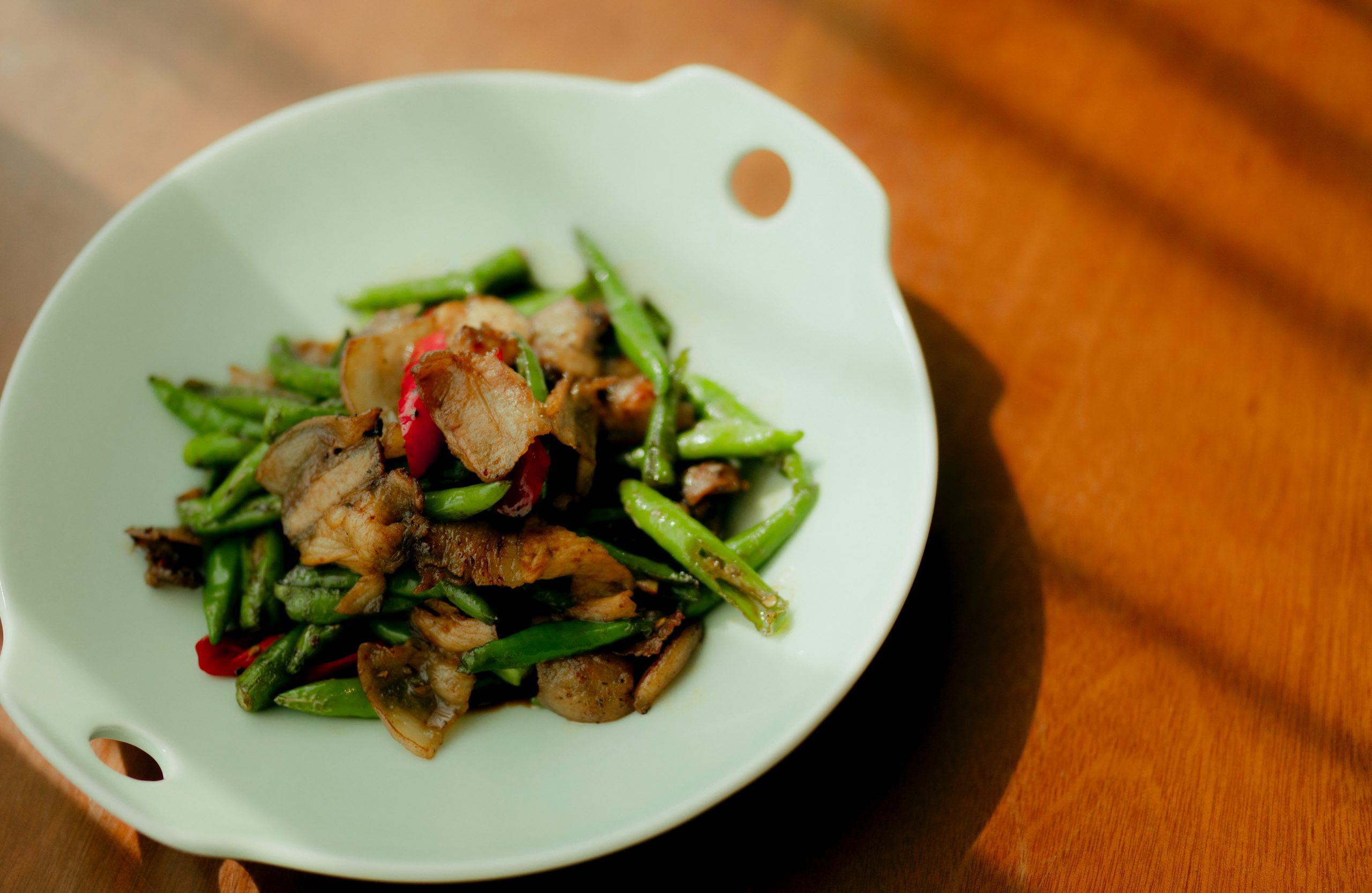 green vegetable dish on white ceramic plate