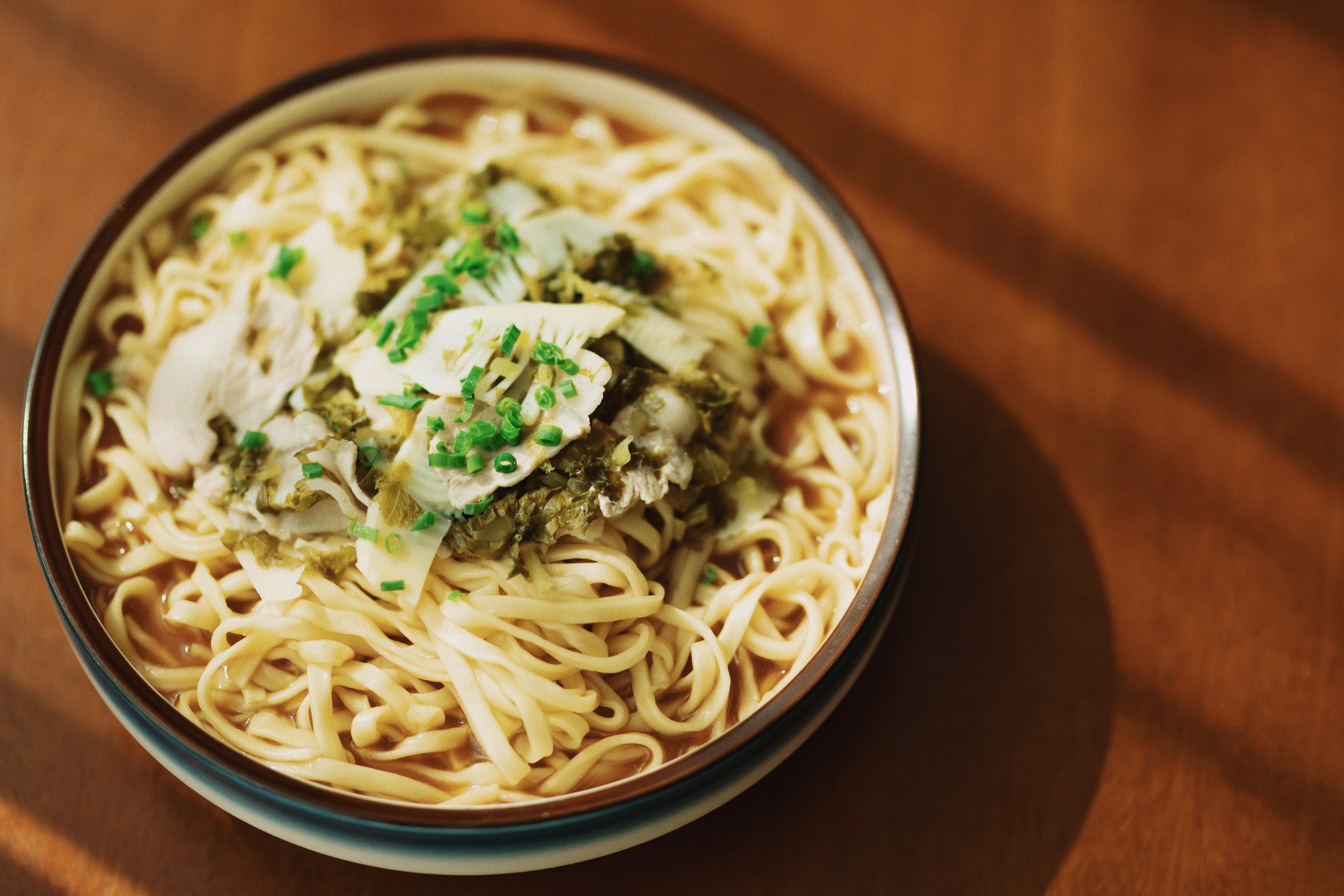 white pasta dish on white ceramic bowl