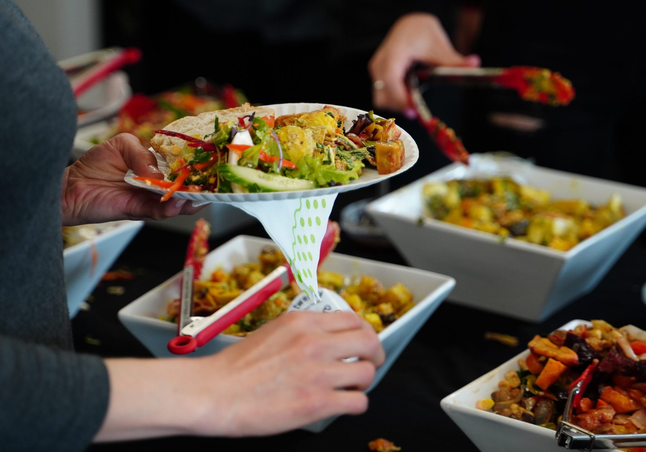 person holding white ceramic bowl with food